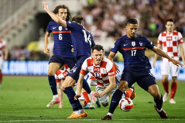 Croatia v France: UEFA Nations League - League Path Group 1 SPLIT, CROATIA - JUNE 06: Ante Budimir of Croatia competes for a ball with Adrien Rabiot (L) and William Saliba (R) of France during the UEFA Nations League League A Group 1 match between Croatia and France at Stadion Poljud on June 6, 2022 in Split, Croatia. MilanxSabic PIXSELL