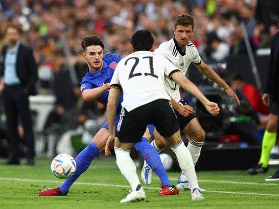 Munich, Germany, 7th June 2022. Declan Rice of England beats Thomas Mueller of Germany to the ball during the UEFA Nations League match at Allianz Arena, Munich. Picture credit should read: David Klein Sportimage EDITORIAL USE ONLY. No use with unauthorised audio, video, data, fixture lists, club league logos or live services. Online in-match use limited to 120 images, no video emulation. No use in betting, games or single club league player publications. SPI-1728-0044