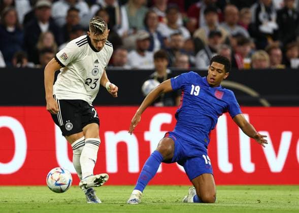 Munich, Germany, 7th June 2022. Nico Schlotterbeck of Germany and Jude Bellingham of England during the UEFA Nations League match at Allianz Arena, Munich. Picture credit should read: David Klein Sportimage EDITORIAL USE ONLY. No use with unauthorised audio, video, data, fixture lists, club league logos or live services. Online in-match use limited to 120 images, no video emulation. No use in betting, games or single club league player publications. SPI-1728-0067