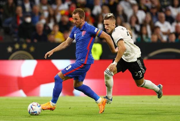 Munich, Germany, 7th June 2022. Harry Kane of England gets clear from Nico Schlotterbeck of Germany during the UEFA Nations League match at Allianz Arena, Munich. Picture credit should read: David Klein Sportimage EDITORIAL USE ONLY. No use with unauthorised audio, video, data, fixture lists, club league logos or live services. Online in-match use limited to 120 images, no video emulation. No use in betting, games or single club league player publications. SPI-1728-0068