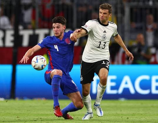 Munich, Germany, 7th June 2022. Declan Rice of England challenges Thomas Mueller of Germany during the UEFA Nations League match at Allianz Arena, Munich. Picture credit should read: David Klein Sportimage EDITORIAL USE ONLY. No use with unauthorised audio, video, data, fixture lists, club league logos or live services. Online in-match use limited to 120 images, no video emulation. No use in betting, games or single club league player publications. SPI-1728-0072