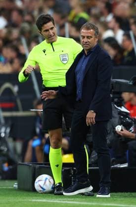 Munich, Germany, 7th June 2022. The Fourth official reacts to Hans-Dieter Flick of Germany during the UEFA Nations League match at Allianz Arena, Munich. Picture credit should read: David Klein Sportimage EDITORIAL USE ONLY. No use with unauthorised audio, video, data, fixture lists, club league logos or live services. Online in-match use limited to 120 images, no video emulation. No use in betting, games or single club league player publications. SPI-1728-0074