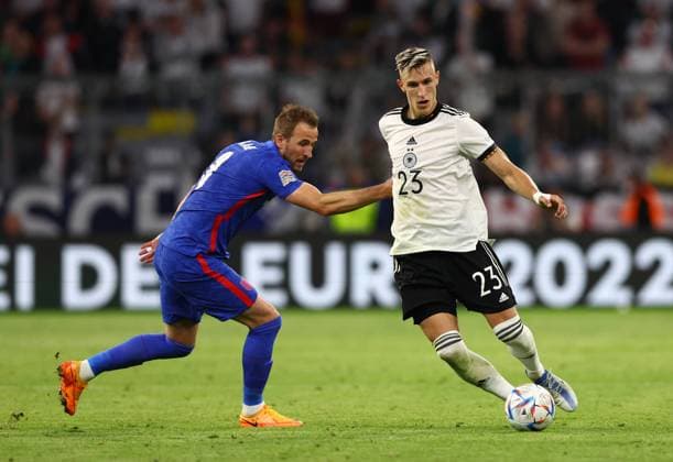 Munich, Germany, 7th June 2022. Nico Schlotterbeck of Germany and Harry Kane of England during the UEFA Nations League match at Allianz Arena, Munich. Picture credit should read: David Klein Sportimage EDITORIAL USE ONLY. No use with unauthorised audio, video, data, fixture lists, club league logos or live services. Online in-match use limited to 120 images, no video emulation. No use in betting, games or single club league player publications. SPI-1728-0100