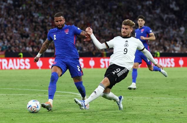 Munich, Germany, 7th June 2022. Timo Werner of Germany shoots past Kyle Walker of England during the UEFA Nations League match at Allianz Arena, Munich. Picture credit should read: David Klein Sportimage EDITORIAL USE ONLY. No use with unauthorised audio, video, data, fixture lists, club league logos or live services. Online in-match use limited to 120 images, no video emulation. No use in betting, games or single club league player publications. SPI-1728-0101