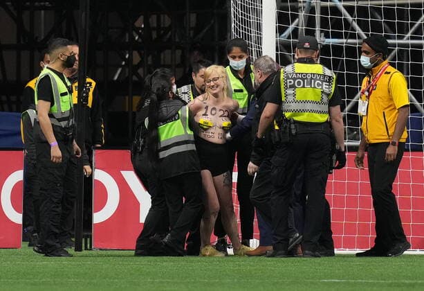 June 9, 2022, VANCOUVER, BC, CANADA: Security remove a save old growth forest protester from the pitch after they interrupted the second half of a Canada and Curacao CONCACAF Nations League soccer match, in Vancouver, on Thursday, June 9, 2022. Canada News - June 9, 2022  - ZUMAc35_ 20220609_zaf_c35_175 Copyright: xDarrylxDyckx