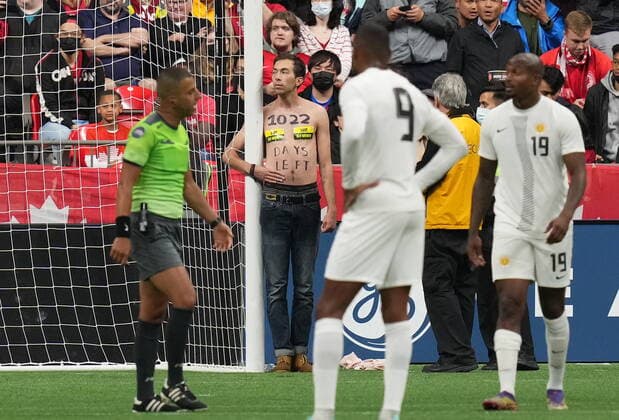 June 9, 2022, VANCOUVER, BC, CANADA: A save old growth forest protester stands with their arm around the goalpost and hand glued to themselves after interrupting the second half of a Canada and Curacao CONCACAF Nations League soccer match, in Vancouver, on Thursday, June 9, 2022. Canada News - June 9, 2022  - ZUMAc35_ 20220609_zaf_c35_177 Copyright: xDarrylxDyckx