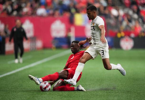 June 9, 2022, VANCOUVER, BC, CANADA: Canada s Sam Adekugbe, back left, slides to take the ball away from Curacao s Jurien Gaari during the second half of a CONCACAF Nations League soccer match, in Vancouver, on Thursday, June 9, 2022. Canada News - June 9, 2022 - ZUMAc35_ 20220609_zaf_c35_188 Copyright: xDarrylxDyckx