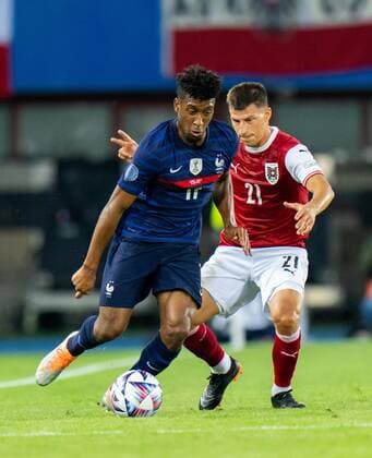SOCCER - NL, AUT vs FRA VIENNA,AUSTRIA,10.JUN.22 - SOCCER - UEFA Nations League, OEFB international match, Länderspiel, Nationalmannschaft Austria vs France. Image shows Kingsley Coman (FRA) and Stefan Lainer (AUT).  GEPAxpictures xEdgarxEisner