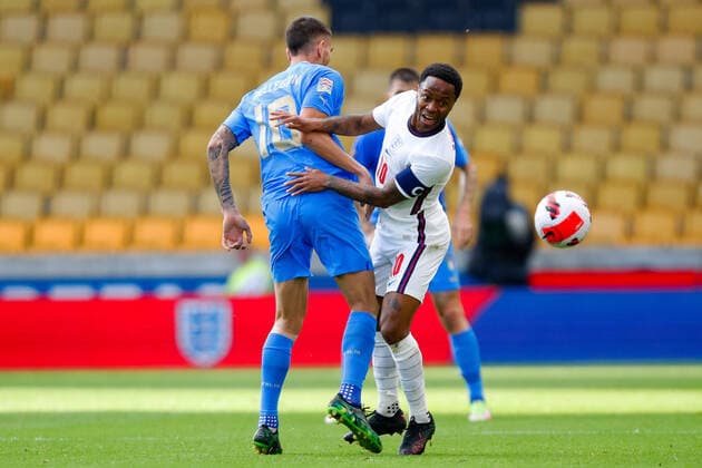 11th June 2022; Molineux Stadium, Wolverhampton, West Midlands, England; UEFA Nations League Football, England versus Italy; Lorenzo Pellegrini of Italy checks the run from Raheem Sterling of England  ActionPlus12398942 GrahamxWilson