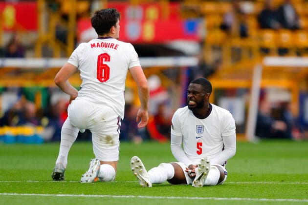 11th June 2022; Molineux Stadium, Wolverhampton, West Midlands, England; UEFA Nations League Football, England versus Italy; Fikayo Tomori of England grimaces after a collision with team-mate Harry Maguire  ActionPlus12398944 GrahamxWilson