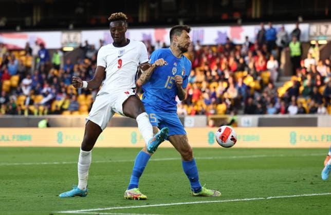 Wolverhampton, England, 11th June 2022. Tammy Abraham of England gets a flick under pressure from Francesco Acerbi of Italy during the UEFA Nations League match at Molineux, Wolverhampton. Picture credit should read: Darren Staples Sportimage EDITORIAL USE ONLY. No use with unauthorised audio, video, data, fixture lists, club league logos or live services. Online in-match use limited to 120 images, no video emulation. No use in betting, games or single club league player publications. SPI-1732-0066