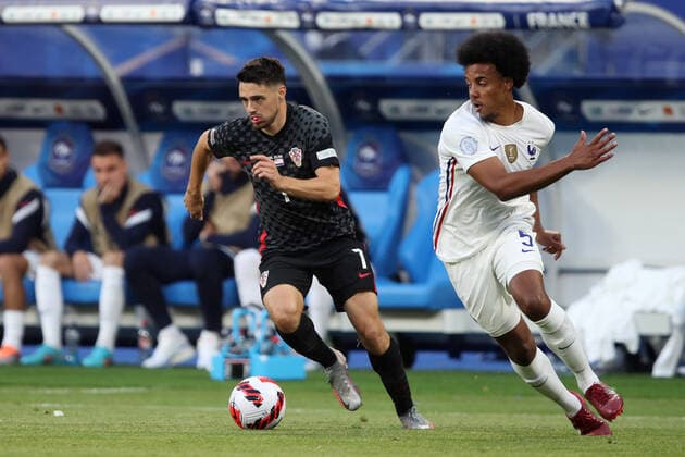 Football - 2022 2023 UEFA Nations League - League A - Group C - France vs Croatia - Stade de France - Monday 13th June 2013 Josip Brekalo of Croatia and Jules Kounde of France 