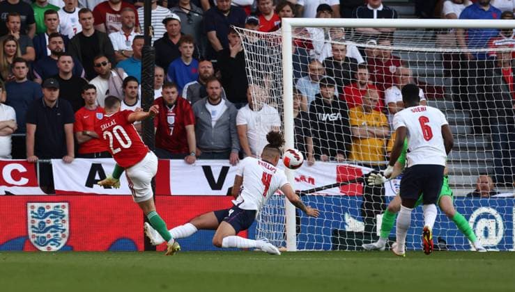 Wolverhampton, England, 14th June 2022. Roland Sallai of Hungary (l) scores the first goal past Aaron Ramsdale of England during the UEFA Nations League match at Molineux, Wolverhampton. Picture credit should read: Darren Staples Sportimage EDITORIAL USE ONLY. No use with unauthorised audio, video, data, fixture lists, club league logos or live services. Online in-match use limited to 120 images, no video emulation. No use in betting, games or single club league player publications. SPI-1734-0024