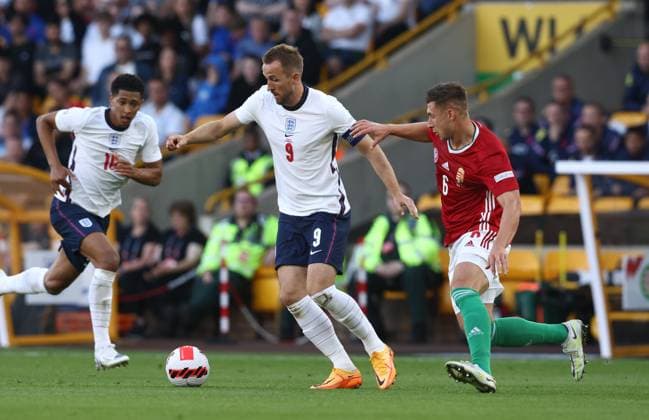 Wolverhampton, England, 14th June 2022. Harry Kane of England and Willi Orban of Hungary during the UEFA Nations League match at Molineux, Wolverhampton. Picture credit should read: Darren Staples Sportimage EDITORIAL USE ONLY. No use with unauthorised audio, video, data, fixture lists, club league logos or live services. Online in-match use limited to 120 images, no video emulation. No use in betting, games or single club league player publications. SPI-1734-0039