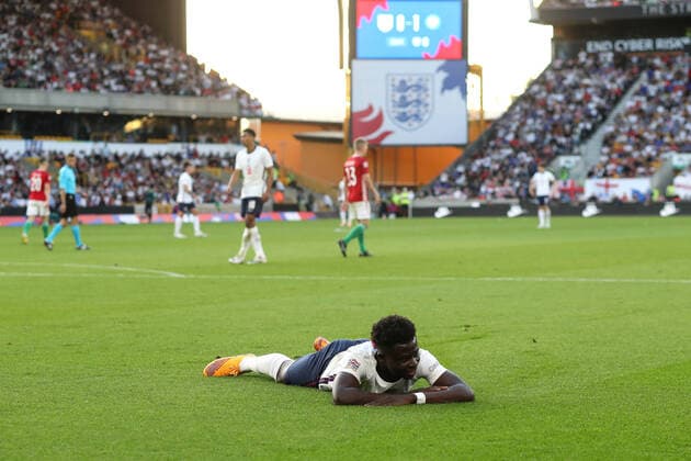 England v Hungary 14 June 2022, Wolverhampton - UEFA Nations League - League A (Group 3) - England v Hungary - Bukayo Saka of England lies on the ground - Photo: Mark Leech Offside. Wolverhampton UK Copyright: xMarkxLeechx xOffsidexOffside