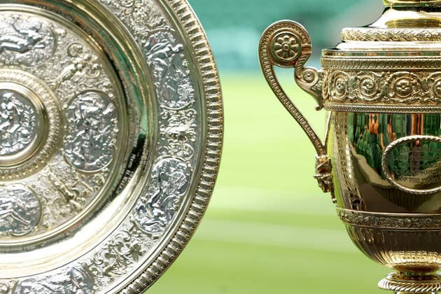 25th June 2022, All England Lawn Tennis and Croquet Club, London, England; Wimbledon Tennis tournament; The men& x2019;s and women& x2019;s trophy& x2019;s on display on centre court  ActionPlus12402286 ShaunxBrooks