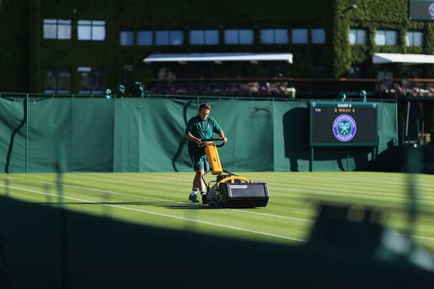 Tennis - Wimbledon (Day 1) 27th June 2022 - Tennis - Wimbledon (Day 1) - Grounds staff mow the grass before the start of play - Photo: Simon Stacpoole Offside. London UK Copyright: xSimonxStacpoolexOffside