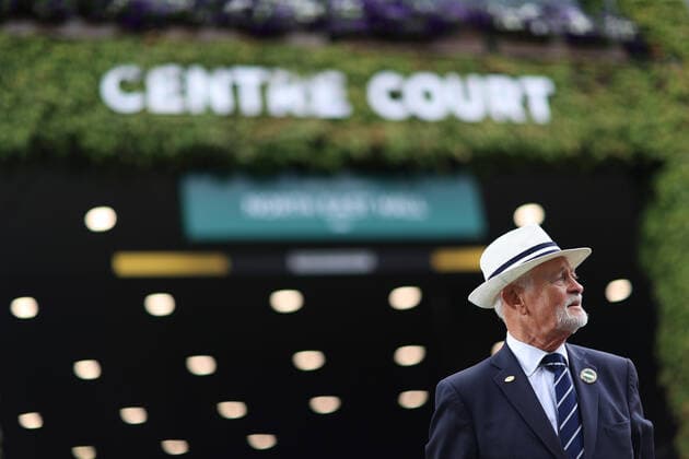 Tennis - Wimbledon (Day 1) 27th June 2022 - Tennis - Wimbledon (Day 1) - A steward looks on outside Centre Court - Photo: Simon Stacpoole Offside. London UK Copyright: xSimonxStacpoolexOffside