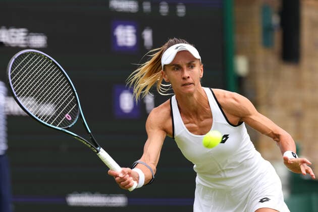 27th June 2022, All England Lawn Tennis and Croquet Club, London, England; Wimbledon Tennis tournament; Lesia Tsurenko plays a volley to Jodie Burrage during the ladies singles  ActionPlus12402567 ShaunxBrooks