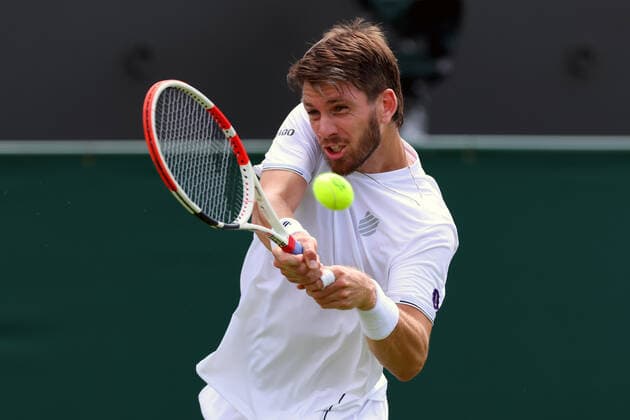 27th June 2022, All England Lawn Tennis and Croquet Club, London, England; Wimbledon Tennis tournament; Cameron Norrie plays a backhand to Pablo Andujar in the mens singles  ActionPlus12402577 ShaunxBrooks