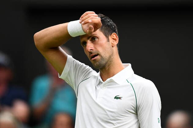 Mandatory Credit: Photo by James Veysey Shutterstock (13002284ay) Novak Djokovic dejected during his first round match Wimbledon Tennis Championships, Day 2, The All England Lawn Tennis and Croquet Club, London, UK - 27 Jun 2022 Wimbledon Tennis Championships, Day 2, The All England Lawn Tennis and Croquet Club, London, UK - 27 Jun 2022  Copyright: xJamesxVeysey Shutterstockx 13002284ay