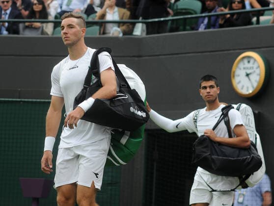 Tennis - 2022 Wimbledon Championships - Week One - Day One (Monday) - All England Lawn Tennis Club, Wimbledon - Monday 27th June 2022 Jan - Lennard Struff v Carlos Alcaraz Arriving on court 