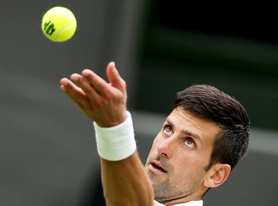 (220628) -- LONDON, June 28, 2022 -- Novak Djokovic serves during the men s singles first round match between Novak Djokovic of Serbia and Kwon Soonwoo of South Korea at Wimbledon Tennis Championship in London, Britain, on June 27, 2022. ) (SP)BRITAIN-LONDON-TENNIS-WIMBLEDON-DAY 1 LixYing 