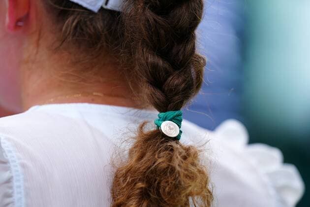 Mandatory Credit: Photo by Javier Garcia Shutterstock (13002021am) The Wimbledon hairband of Jelena Ostapenko Wimbledon Tennis Championships, Day 2, The All England Lawn Tennis and Croquet Club, London, UK - 28 Jun 2022 Wimbledon Tennis Championships, Day 2, The All England Lawn Tennis and Croquet Club, London, UK - 28 Jun 2022  Copyright: xJavierxGarcia Shutterstockx 13002021am