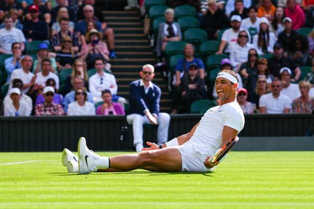 Mandatory Credit: Photo by Javier Garcia Shutterstock (13002021gn) Rafael Nadal slips over during his first round match Wimbledon Tennis Championships, Day 2, The All England Lawn Tennis and Croquet Club, London, UK - 28 Jun 2022 Wimbledon Tennis Championships, Day 2, The All England Lawn Tennis and Croquet Club, London, UK - 28 Jun 2022  Copyright: xJavierxGarcia Shutterstockx 13002021gn