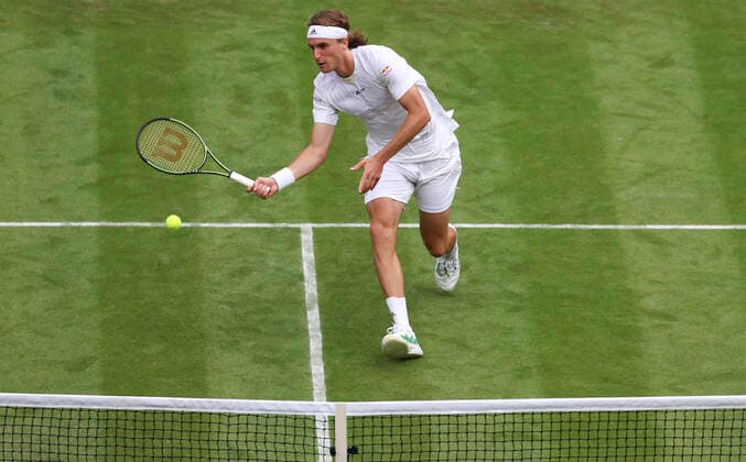(220629) -- LONDON, June 29, 2022 -- Stefanos Tsitsipas competes during the men s singles first round match between Stefanos Tsitsipas of Greece and Alexander Ritschard of Switzerland at Wimbledon Tennis Championship in London, Britain, on June 28, 2022. ) (SP)BRITAIN-LONDON-TENNIS-WIMBLEDON-DAY 2 HanxYan 