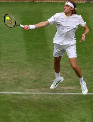 (220629) -- LONDON, June 29, 2022 -- Stefanos Tsitsipas competes during the men s singles first round match between Stefanos Tsitsipas of Greece and Alexander Ritschard of Switzerland at Wimbledon Tennis Championship in London, Britain, on June 28, 2022. ) (SP)BRITAIN-LONDON-TENNIS-WIMBLEDON-DAY 2 HanxYan 