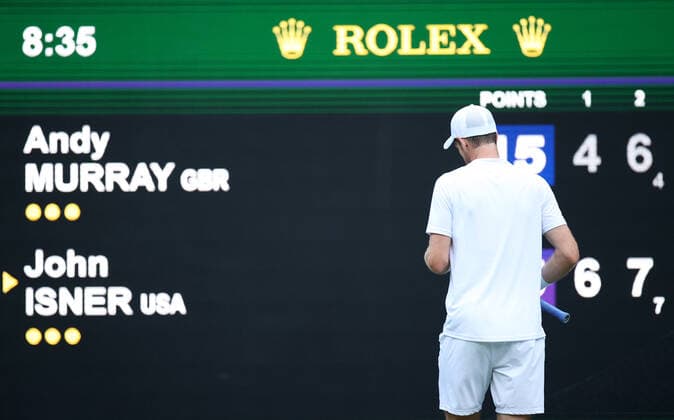 (220630) -- LONDON, June 30, 2022 -- Andy Murray of Britain reacts during the men s singles 2nd round match against John Isner of the United States at Wimbledon Tennis Championship in London, Britain, June 29, 2022. ) (SP)BRITAIN-LONDON-TENNIS-WIMBLEDON LixYing 