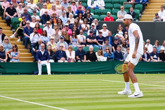 Mandatory Credit: Photo by Javier Garcia Shutterstock (13010731bp) Nick Kyrgios plays a shot through his legs during his second round match Wimbledon Tennis Championships, Day 4, The All England Lawn Tennis and Croquet Club, London, UK - 30 Jun 2022 Wimbledon Tennis Championships, Day 4, The All England Lawn Tennis and Croquet Club, London, UK - 30 Jun 2022  Copyright: xJavierxGarcia Shutterstockx 13010731bp