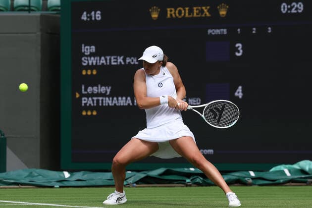 30th June 2022, All England Lawn Tennis and Croquet Club, London, England; Wimbledon Tennis tournament; Iga Swiatek plays a backhand to Lesley Pattinama Kerkhove in the ladies singles  ActionPlus12403293 ShaunxBrooks