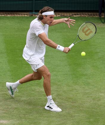 (220701) -- LONDON, July 1, 2022 -- Stefanos Tsitsipas competes during the men s singles second round match between Stefanos Tsitsipas of Greece and Jordan Thompson of Australia at Wimbledon Tennis Championship in London, Britain, on June 30, 2022. ) (SP)BRITAIN-LONDON-TENNIS-WIMBLEDON-MEN S SINGLES HanxYan 