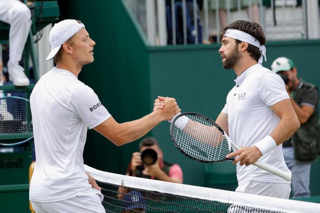 R-L Nikoloz Basilashvili gratuliert dem Sieger Tim Van Rijthofen Tennis - Wimbledon 2022 - Grand Slam ITF ATP, Tennis Herren WTA, Tennis Damen - AELTC - London - - Great Britain - 1 July 2022. Copyright: xJuergenxHasenkopfx