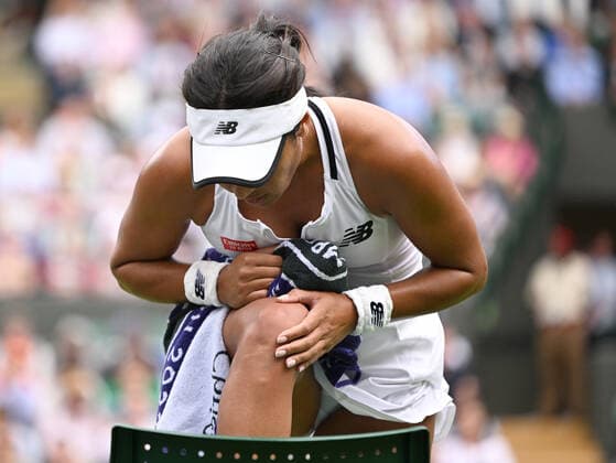 nChampionships - Week One - Day Two (Friday) - All England Lawn Tennis Club, Wimbledon - Friday 1st July 2022 Heather Watson Kaja Juvan (SLO) Heather Watson of Great Britain checks out her knee after slipping on the grass 