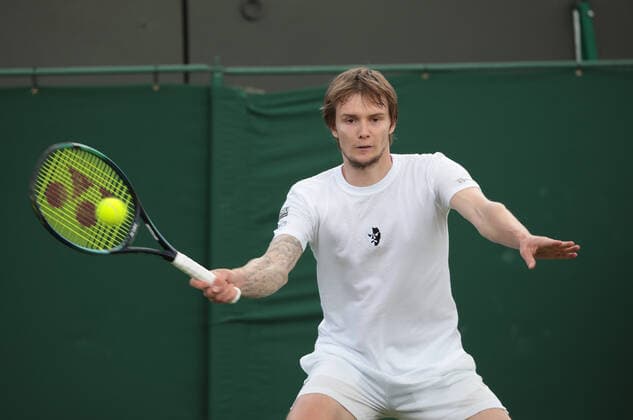 Kazakhstan s Alexander Bublik in action in his third round match against American Frances Tiafoe on day five of the 2022 Wimbledon championships in London on Friday, July 01, 2022. Tiafoe won the match 3-6,7-6,7-6,6-4.  LON2022070121 HUGOxPHILPOTT