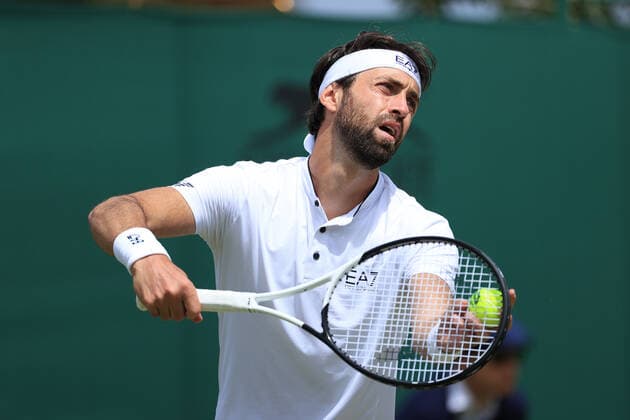 Tennis - Wimbledon (Day 5) 1st July 2022 - Tennis - Wimbledon (Day 5) - Nikoloz Basilashvili (GEO) serves to Tim Van Rijthoven (NED) during their Gentlemen s Singles 3rd Round match - Photo: Simon Stacpoole Offside. London UK Copyright: xSimonxStacpoolexOffside