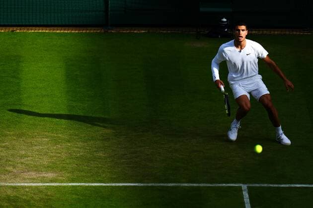 Mandatory Credit: Photo by Javier Garcia Shutterstock (13012399fg) Carlos Alcaraz during his third round match Wimbledon Tennis Championships, Day 5, The All England Lawn Tennis and Croquet Club, London, UK - 01 Jul 2022 Wimbledon Tennis Championships, Day 5, The All England Lawn Tennis and Croquet Club, London, UK - 01 Jul 2022  Copyright: xJavierxGarcia Shutterstockx 13012399fg