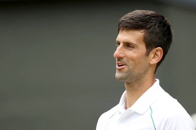 (220702) -- LONDON, July 2, 2022 -- Novak Djokovic reacts during the men s singles third round match between Novak Djokovic of Serbia and Miomir Kecmanovic of Serbia at Wimbledon Tennis Championship in London, Britain, on July 1, 2022. ) (SP)BRITAIN-LONDON-TENNIS-WIMBLEDON-MEN S SINGLES LixYing 