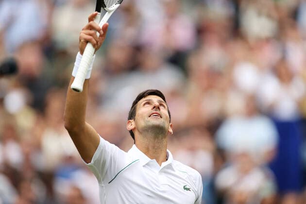 (220702) -- LONDON, July 2, 2022 -- Novak Djokovic celebrates victory after winning the men s singles third round match between Novak Djokovic of Serbia and Miomir Kecmanovic of Serbia at Wimbledon Tennis Championship in London, Britain, on July 1, 2022. ) (SP)BRITAIN-LONDON-TENNIS-WIMBLEDON-MEN S SINGLES LixYing 