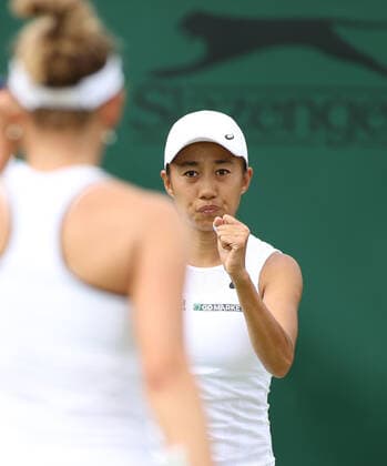 (220702) -- LONDON, July 2, 2022 -- Zhang Shuai (R) of China Elise Mertens of Belgium celebrate during the women s doubles 2nd round match against Viktorija Golubic of Switzerland Camila Osorio of Colombia at Wimbledon Tennis Championship in London, Britain, July 2, 2022. ) (SP)BRITAIN-LONDON-TENNIS-WIMBLEDON-WOMEN S DOUBLES LixYing 