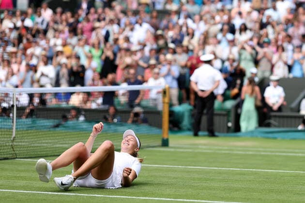 2nd July 2022, All England Lawn Tennis and Croquet Club, London, England; Wimbledon Tennis tournament; Amanda Anisimova falls to the court as she celebrates winning the match against Coco Gauff in the womens singles  ActionPlus12404033 ShaunxBrooks