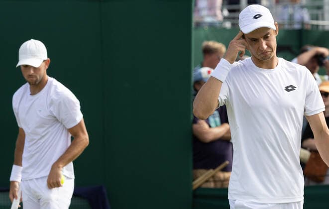 Belgian Joran Vliegen (R) and US Jackson Withrow look dejected during a second round game in the men s doubles tournament between Belgian Vliegen - US Withrow and Australian Ebden - Australian Purcell at the 2022 Wimbledon grand slam tennis tournament at the All England Tennis Club, in south-west London, Britain, Saturday 02 July 2022. BENOITxDOPPAGNE  x36951705x