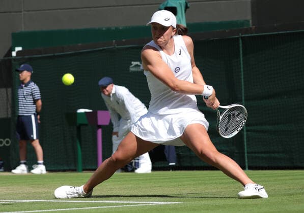 Poland s Iga Swiatek plays France s Alize Cornet during their women s singles tennis match on the sixth day of the 2022 Wimbledon Championships at The All England Tennis Club in Wimbledon, southwest London, on July 2, 2022.  Copyright: xx