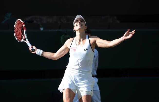 French Alize Cornet celebrates victory in her third round match against Polish Iga Swiatek on day six of the 2022 Wimbledon championships in London on Saturday, July 02, 2022.Cornet won the match 6-4,6-2.  LON2022070258 HUGOxPHILPOTT