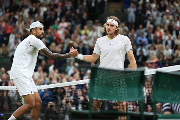 Tennis - Wimbledon (Day 6) 2nd July 2022 - Tennis - Wimbledon (Day 6) - Nick Kyrgios (AUS) (L) shakes hands with Stefanos Tsitsipas (GRE) after their Gentlemen s Singles 3rd Round match - Photo: Simon Stacpoole Offside. London UK Copyright: xSimonxStacpoolexOffside