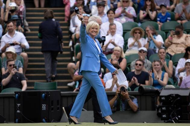 Mandatory Credit: Photo by Ella Ling Shutterstock (13012853f) Sue Barker and John McEnroe walk onto Centre Court to host the centenary celebrations Wimbledon Tennis Championships, Day 7, The All England Lawn Tennis and Croquet Club, London, UK - 03 Jul 2022 Wimbledon Tennis Championships, Day 7, The All England Lawn Tennis and Croquet Club, London, UK - 03 Jul 2022  Copyright: xEllaxLing Shutterstockx 13012853f