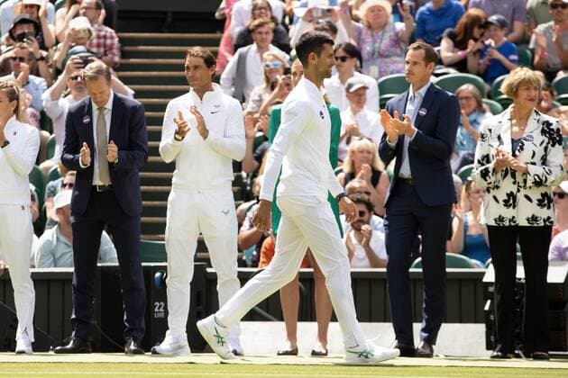Mandatory Credit: Photo by Ella Ling Shutterstock (13012853ac) Novak Djokovic walks past fellow champions on Centre Court as part of the centenary celebrations Wimbledon Tennis Championships, Day 7, The All England Lawn Tennis and Croquet Club, London, UK - 03 Jul 2022 Wimbledon Tennis Championships, Day 7, The All England Lawn Tennis and Croquet Club, London, UK - 03 Jul 2022  Copyright: xEllaxLing Shutterstockx 13012853ac